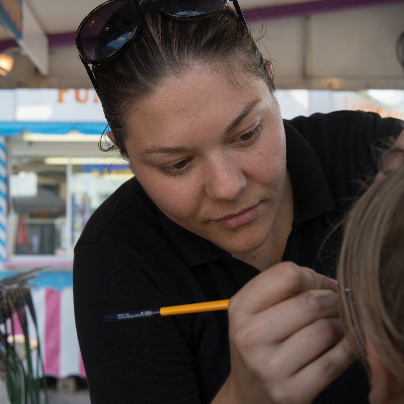 A face painter using a paint brush