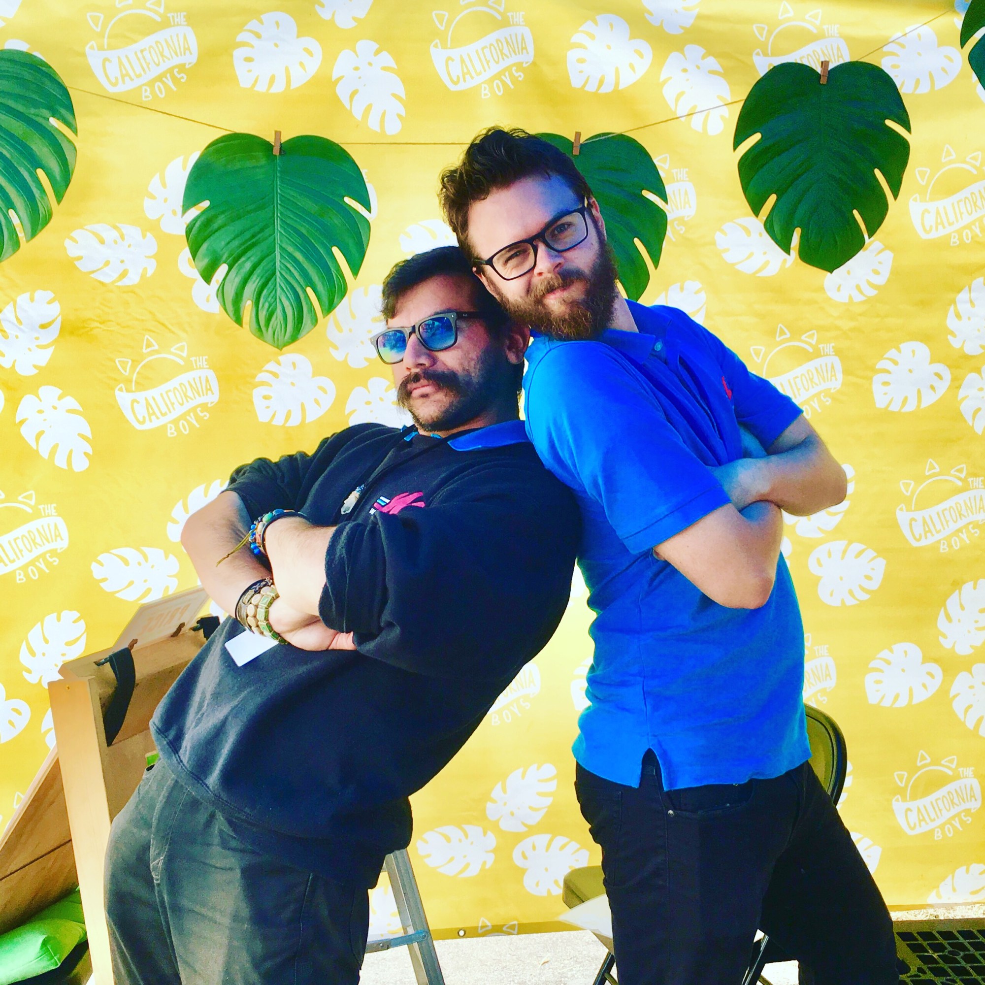 Two artists posing inside of the tent