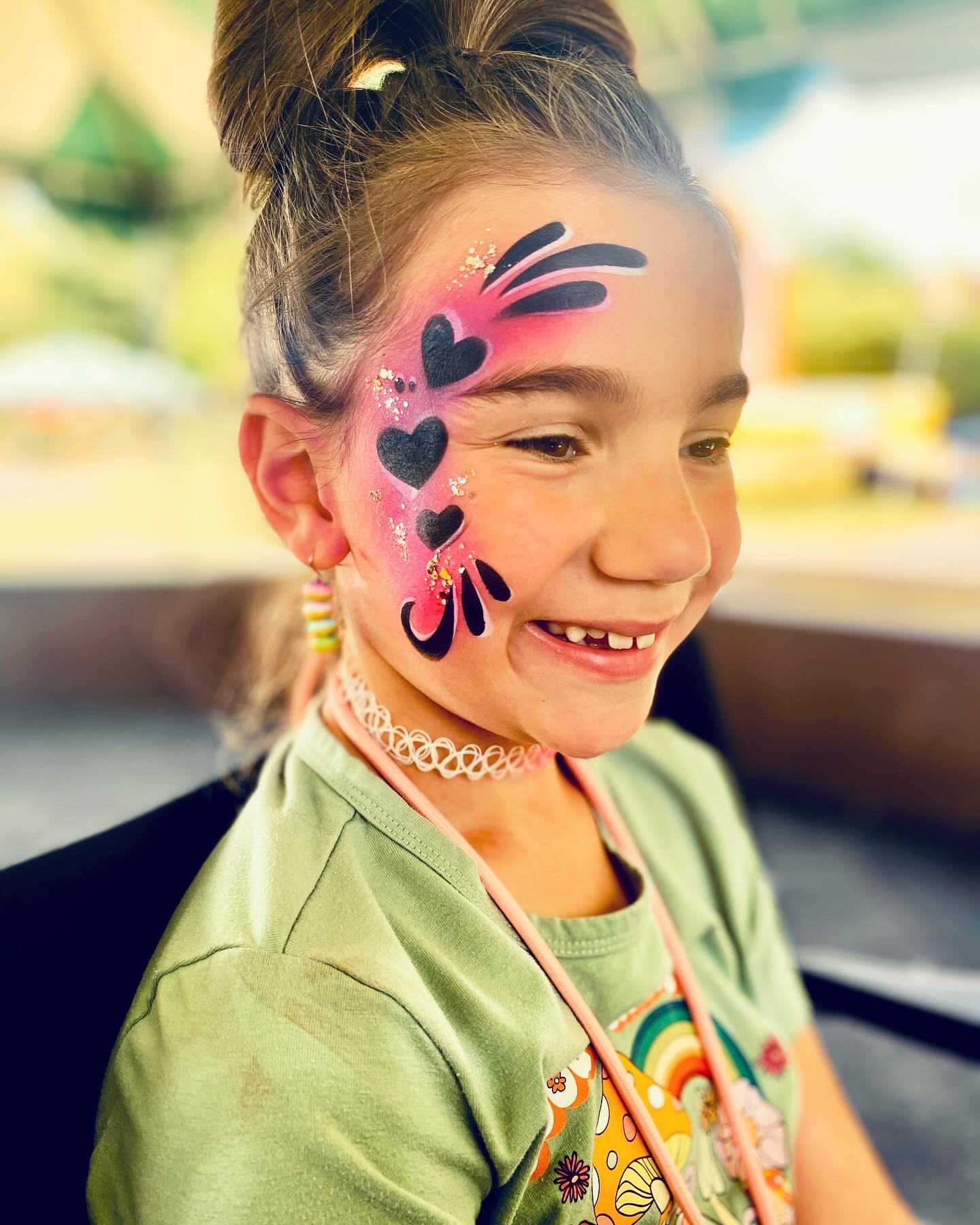A heart themed airbrush water proof face paint