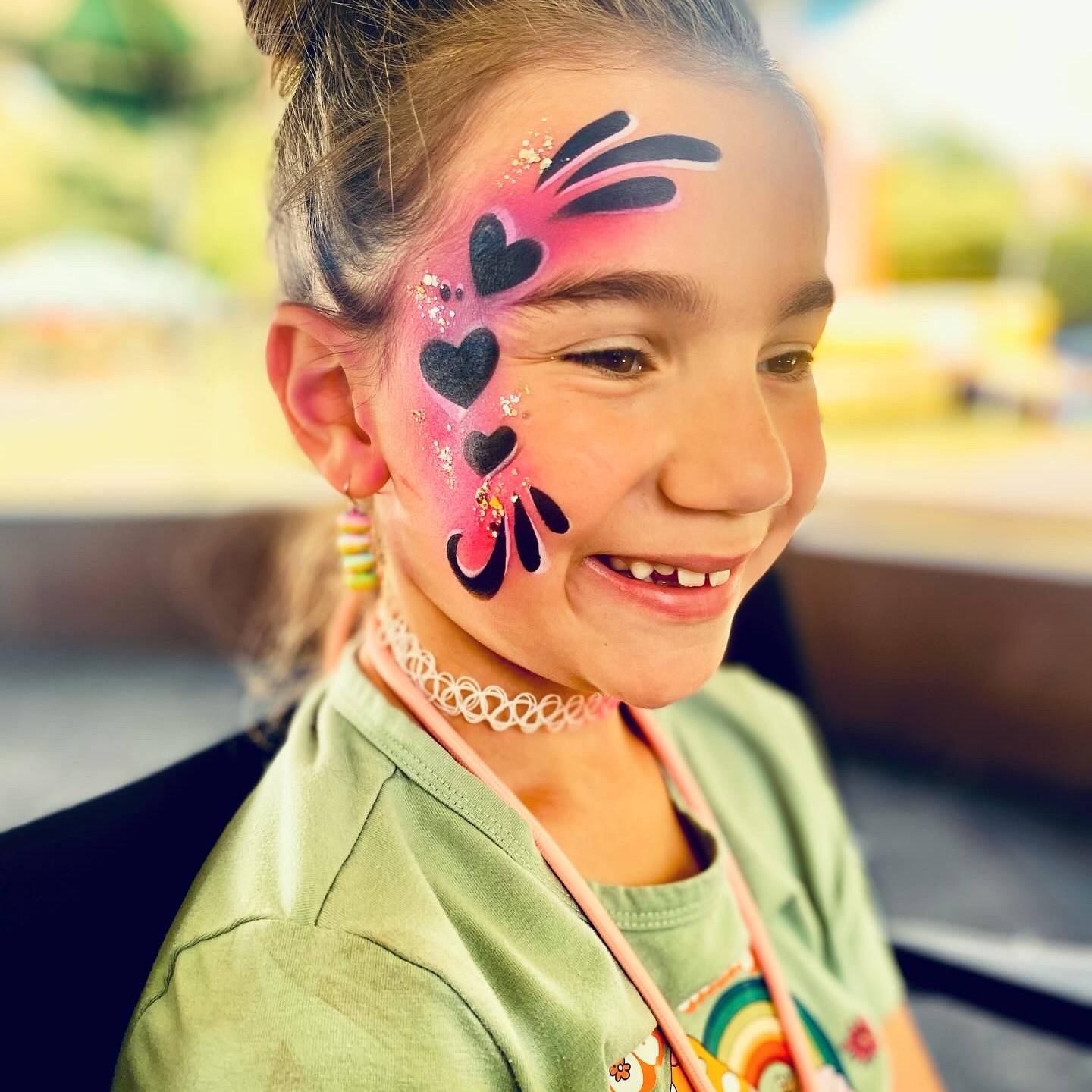 A heart themed airbrush water proof face paint