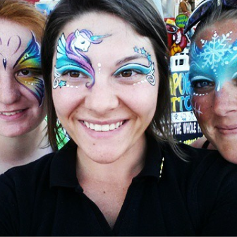 Three women with their faces painted