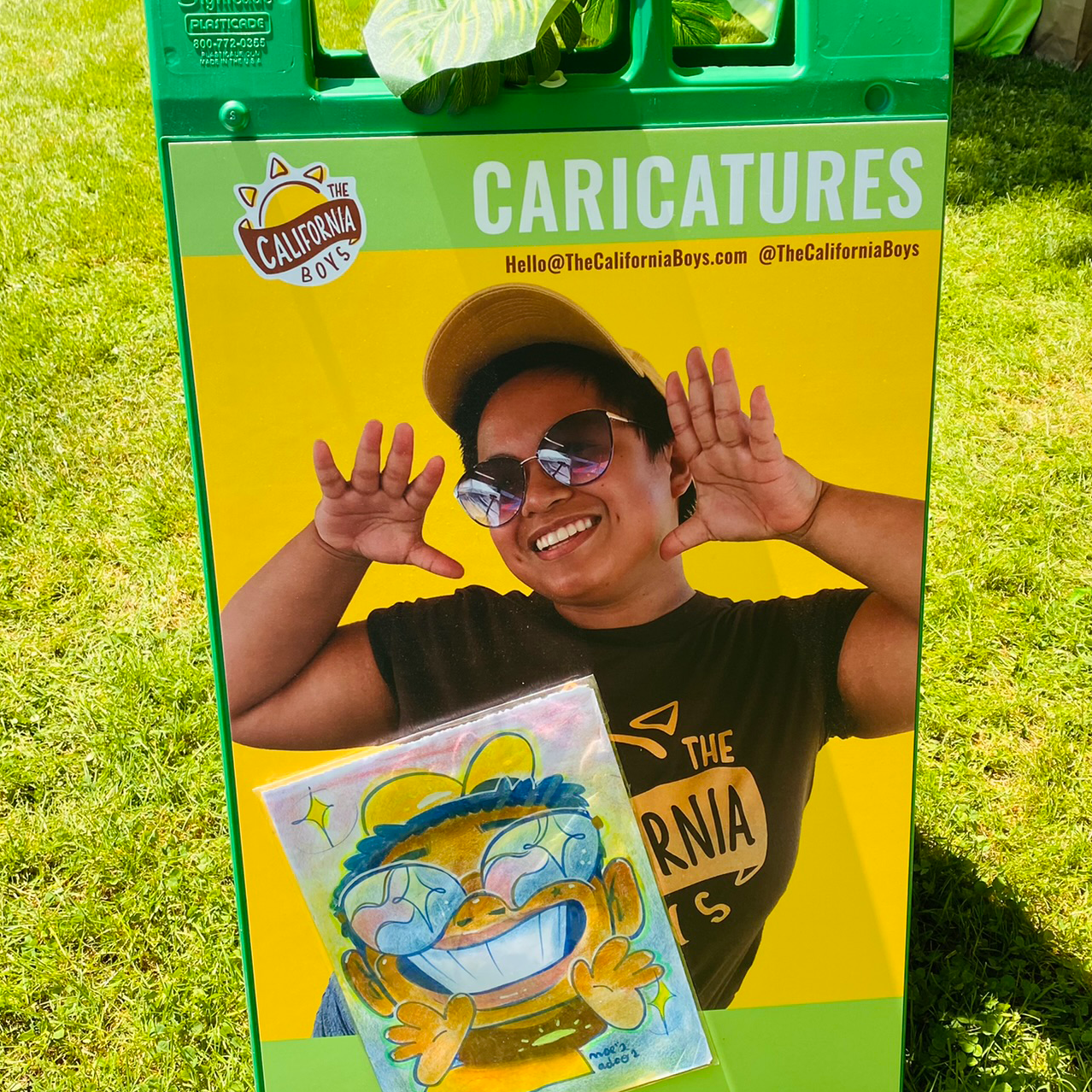 A green a frame sign with a caricature advertisement